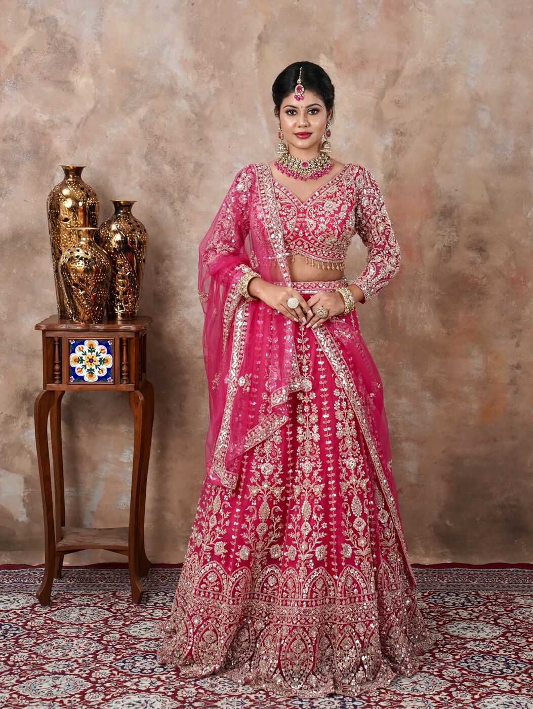 Bride in magenta embroidered lehenga